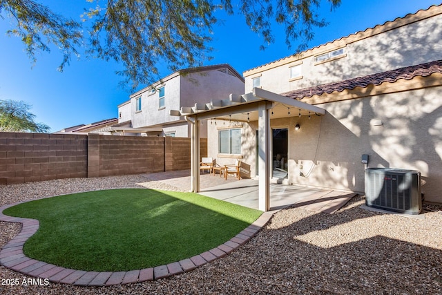 back of house with fence, cooling unit, a yard, a patio area, and stucco siding