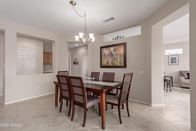 dining space featuring visible vents, baseboards, a chandelier, and light tile patterned flooring