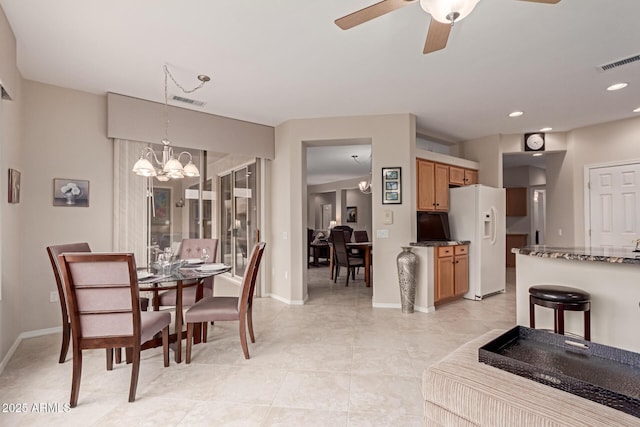 dining space with recessed lighting, visible vents, baseboards, and ceiling fan with notable chandelier