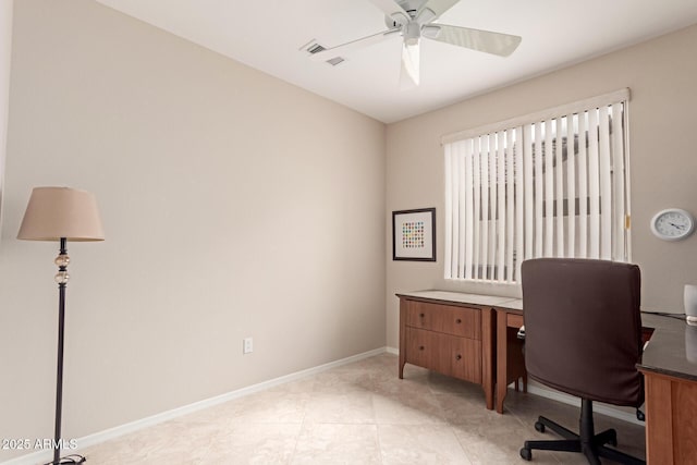 office area featuring visible vents, baseboards, and ceiling fan