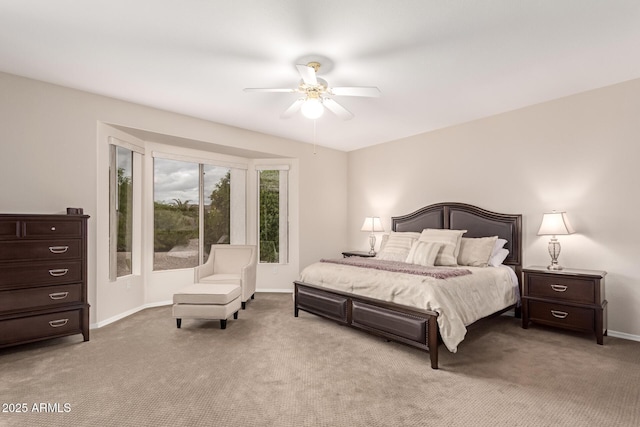 bedroom featuring a ceiling fan, baseboards, and carpet floors