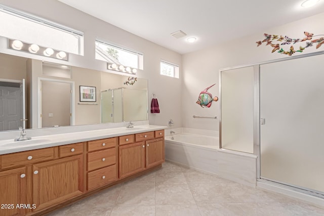 full bath with double vanity, a shower stall, a garden tub, and a sink