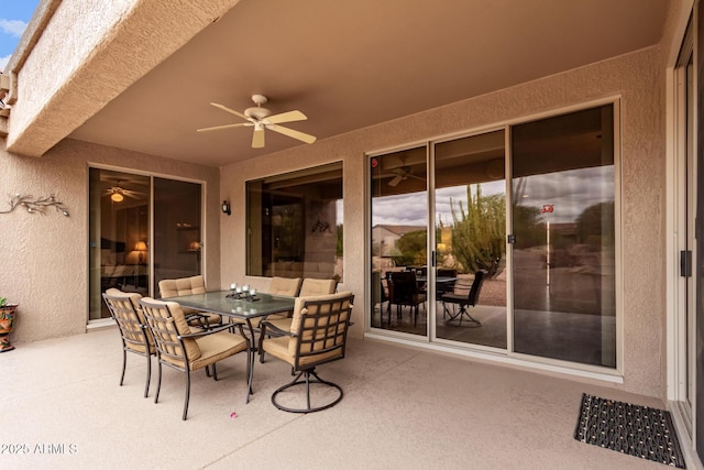 view of patio / terrace featuring outdoor dining space and a ceiling fan