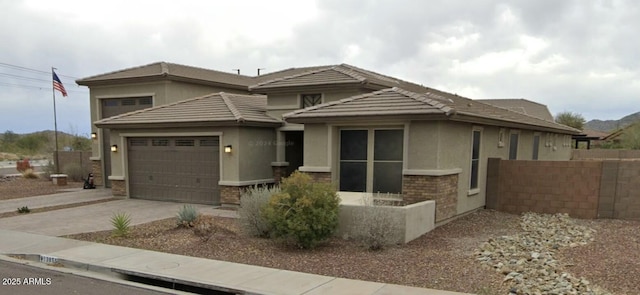 prairie-style house featuring a garage