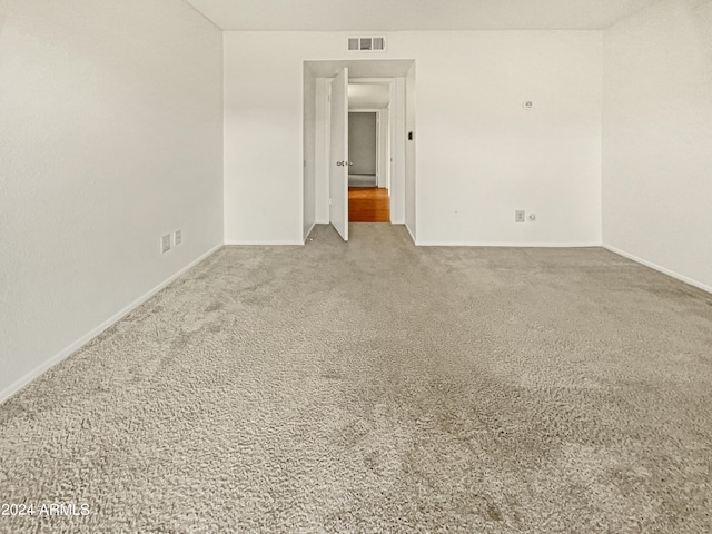 unfurnished room featuring carpet flooring