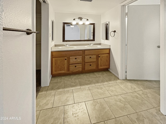 bathroom with vanity and tile patterned floors