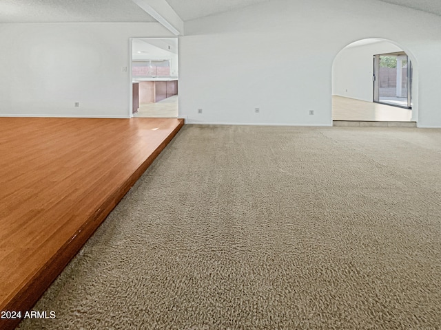 unfurnished living room with a textured ceiling and carpet