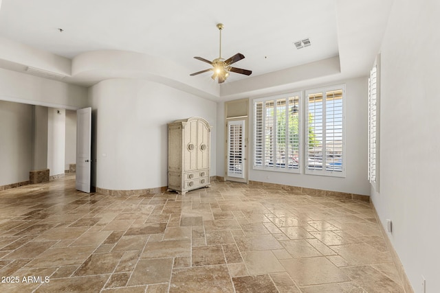 11986 N 134th Pl, Scottsdale, AZ 85259 - spare room with stone tile flooring, ceiling fan, and baseboards