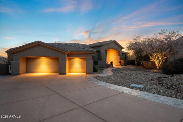 11986 N 134th Pl, Scottsdale, AZ 85259 - ranch-style house featuring a garage, stucco siding, concrete driveway, and a tiled roof