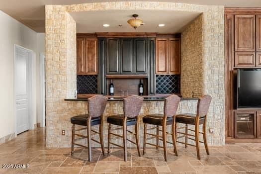 11986 N 134th Pl, Scottsdale, AZ 85259 - indoor wet bar with light stone finish flooring