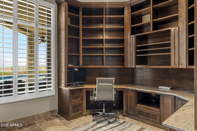 11986 N 134th Pl, Scottsdale, AZ 85259 - unfurnished office featuring built in desk, stone tile floors, and baseboards