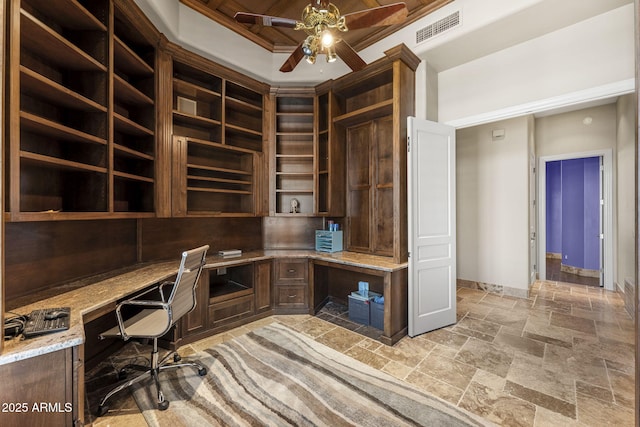 11986 N 134th Pl, Scottsdale, AZ 85259 - unfurnished office featuring built in desk, ceiling fan, stone tile floors, and baseboards