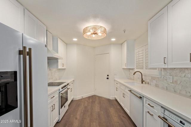 7710 E Gainey Ranch Rd Unit 142, Scottsdale, AZ 85258 - kitchen featuring refrigerator with ice dispenser, high end range, a sink, wall chimney exhaust hood, and dishwashing machine
