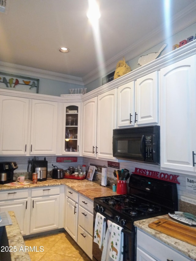 kitchen featuring black appliances, white cabinetry, crown molding, light tile patterned floors, and decorative backsplash