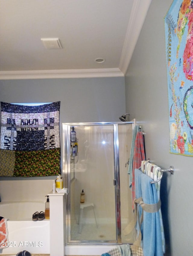 full bath featuring a garden tub, a stall shower, and ornamental molding