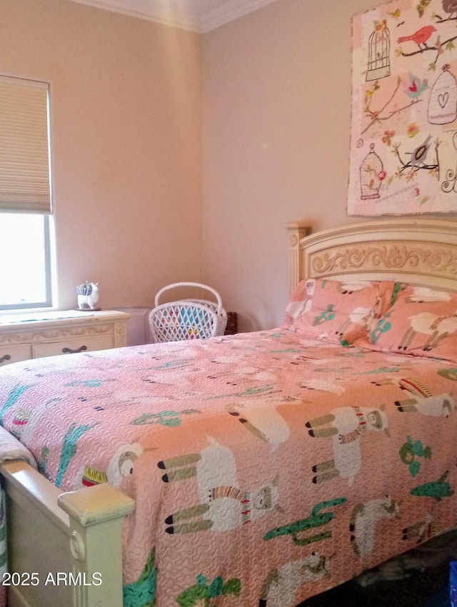 bedroom featuring crown molding