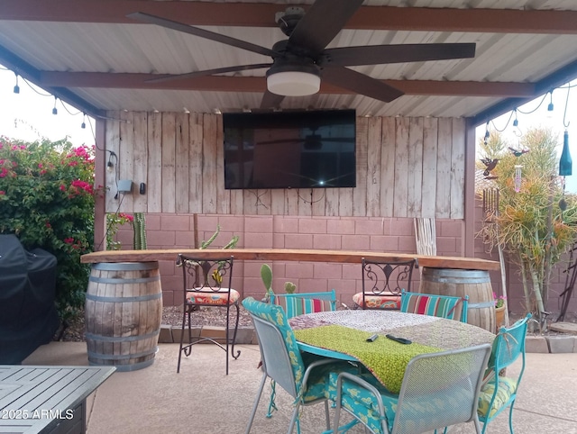 view of patio / terrace featuring outdoor dining space, area for grilling, and a ceiling fan