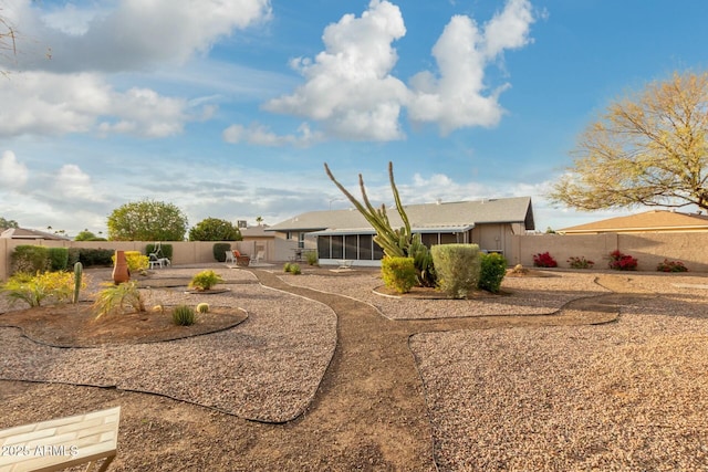 view of yard with a patio area and a sunroom