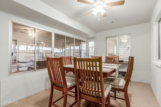 dining area featuring ceiling fan and light tile patterned floors