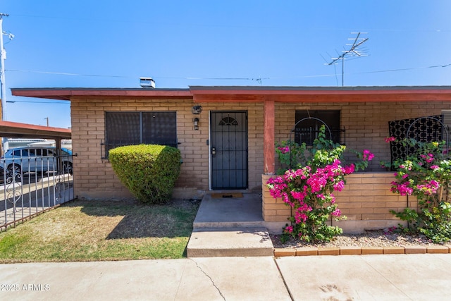6739 N 16th St Unit 14, Phoenix, AZ 85016 - view of front of home featuring a porch and brick siding