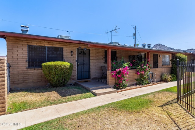 6739 N 16th St Unit 14, Phoenix, AZ 85016 - view of front facade featuring covered porch and brick siding