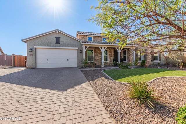 view of front of house featuring a garage and a front yard