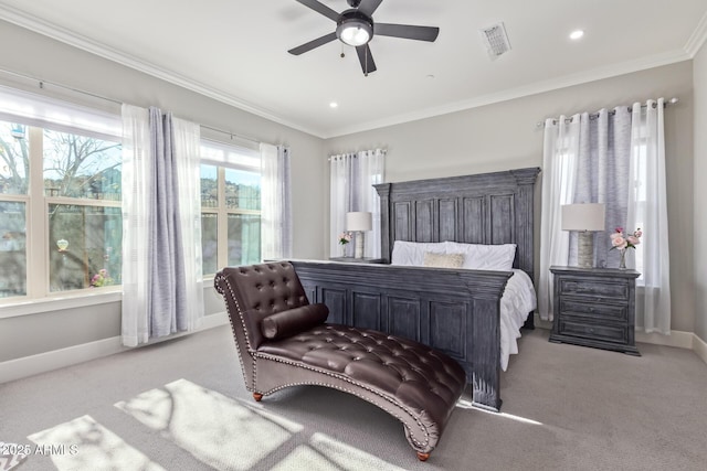 carpeted bedroom with ornamental molding and ceiling fan