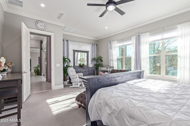 bedroom featuring light carpet, crown molding, and ceiling fan