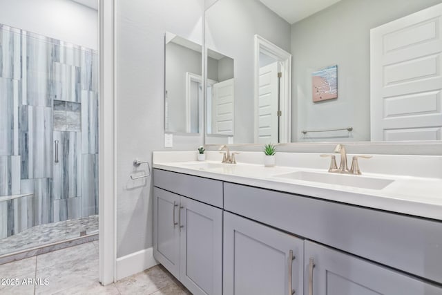 bathroom with vanity, a shower with shower door, and tile patterned floors