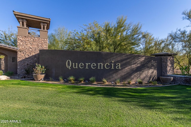 community / neighborhood sign featuring a lawn