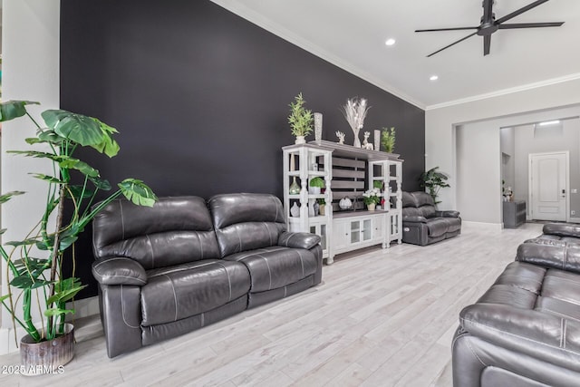 living room with ornamental molding, ceiling fan, and light hardwood / wood-style floors