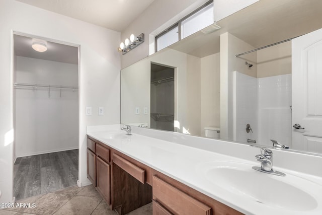 full bathroom with vanity, tile patterned flooring, toilet, and shower / bath combination