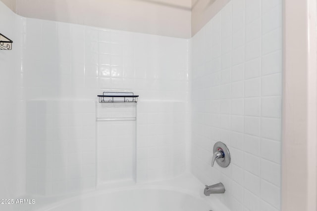 interior space featuring tiled shower / bath