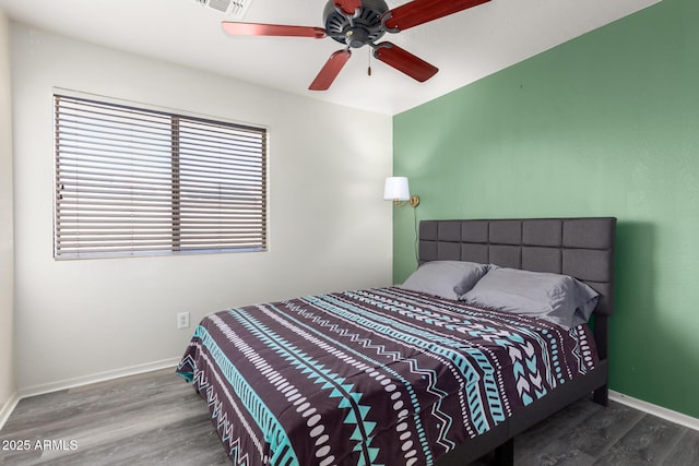 bedroom with ceiling fan and wood-type flooring