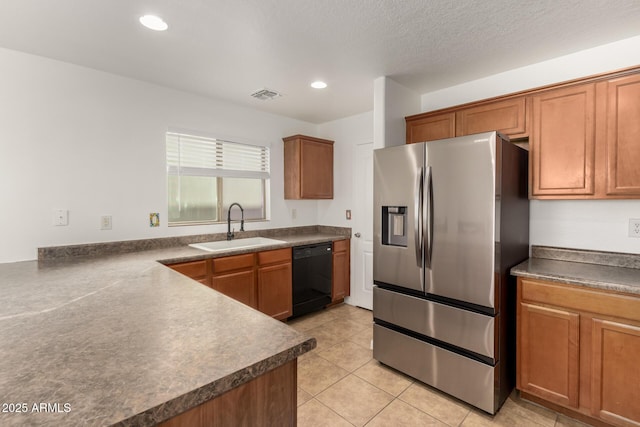 kitchen featuring light tile patterned floors, sink, black dishwasher, a textured ceiling, and stainless steel fridge with ice dispenser