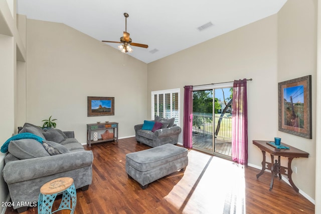 living room featuring ceiling fan, dark hardwood / wood-style flooring, and high vaulted ceiling