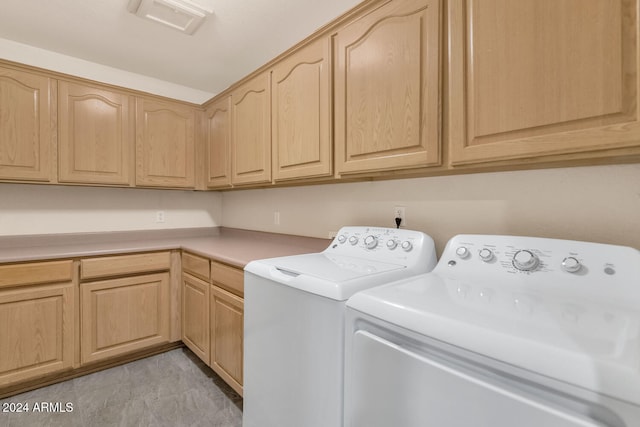 laundry area with cabinets and washer and dryer