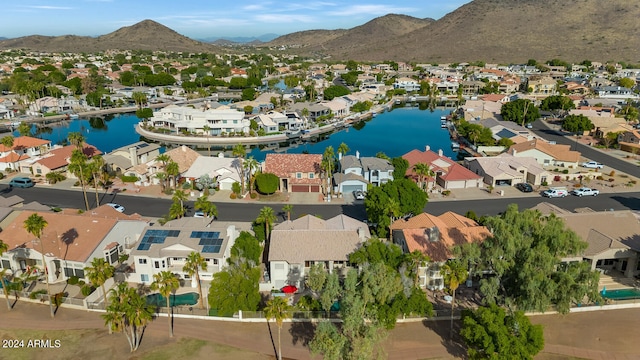 birds eye view of property featuring a water and mountain view