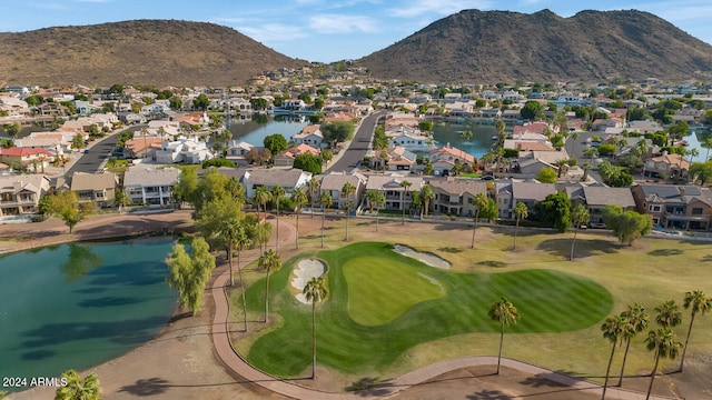 aerial view featuring a water and mountain view