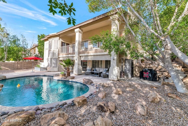 view of pool featuring an outdoor hangout area and a patio