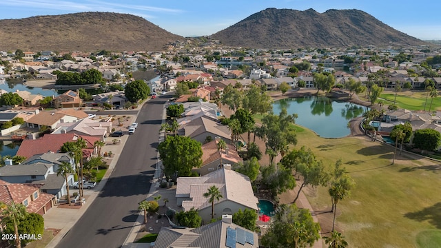 drone / aerial view with a water and mountain view