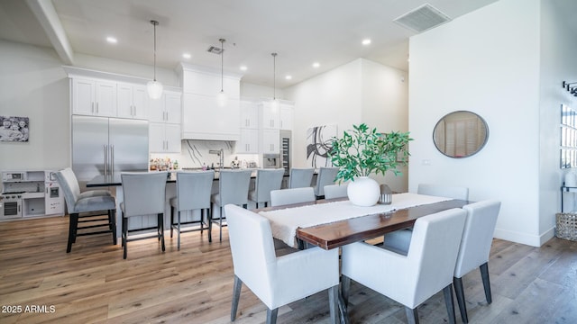 dining space featuring light hardwood / wood-style flooring