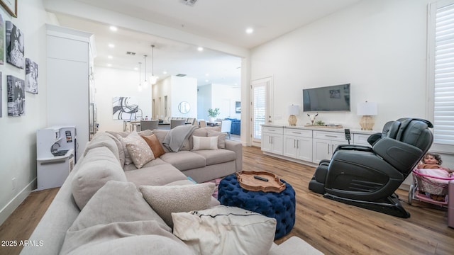 living room with light hardwood / wood-style floors