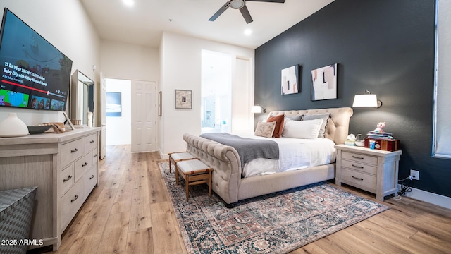 bedroom featuring light hardwood / wood-style flooring and ceiling fan