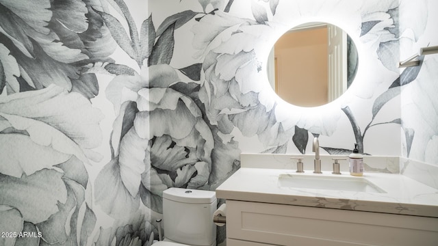 bathroom with vanity and toilet