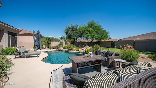 view of pool featuring pool water feature, an outdoor hangout area, and a patio