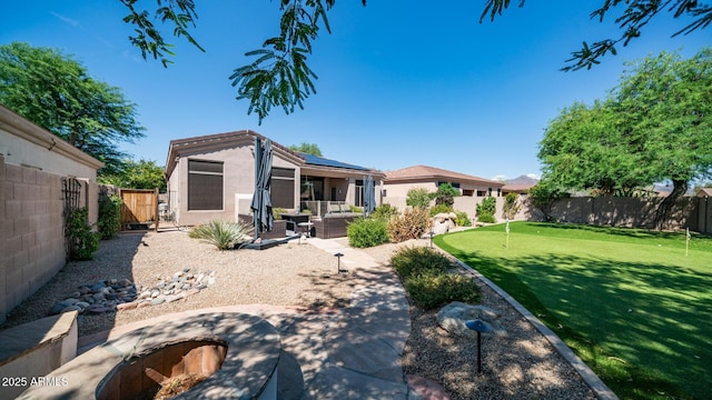 rear view of property with a patio area and outdoor lounge area