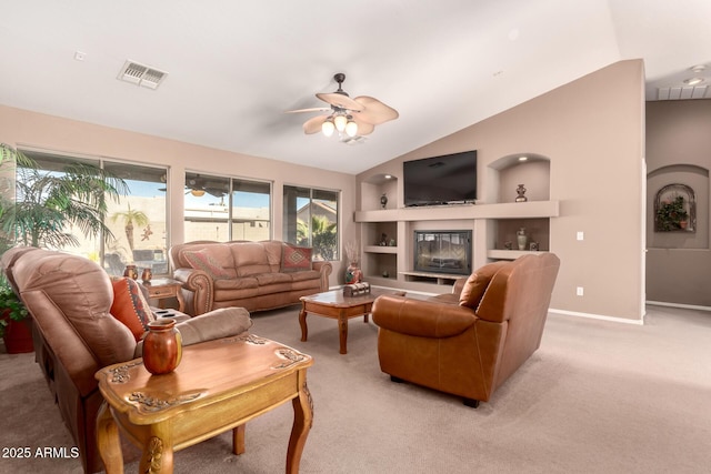 living room featuring built in shelves, light colored carpet, and lofted ceiling