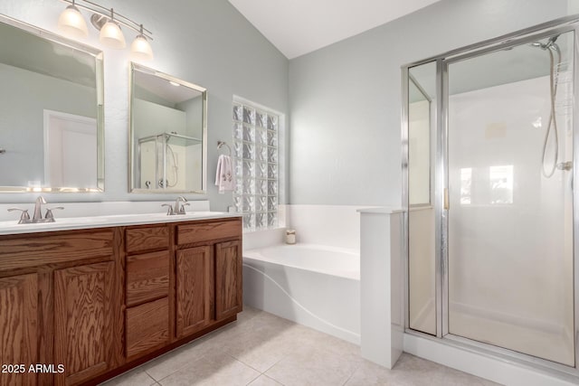 bathroom with tile patterned floors, vanity, and independent shower and bath