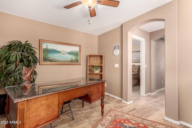 office with ceiling fan and light wood-type flooring